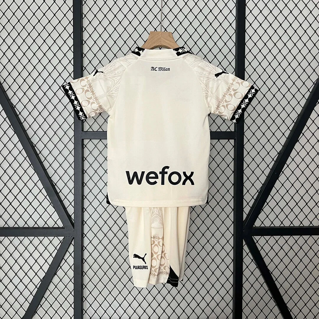 a t - shirt and pants hanging on a wall
